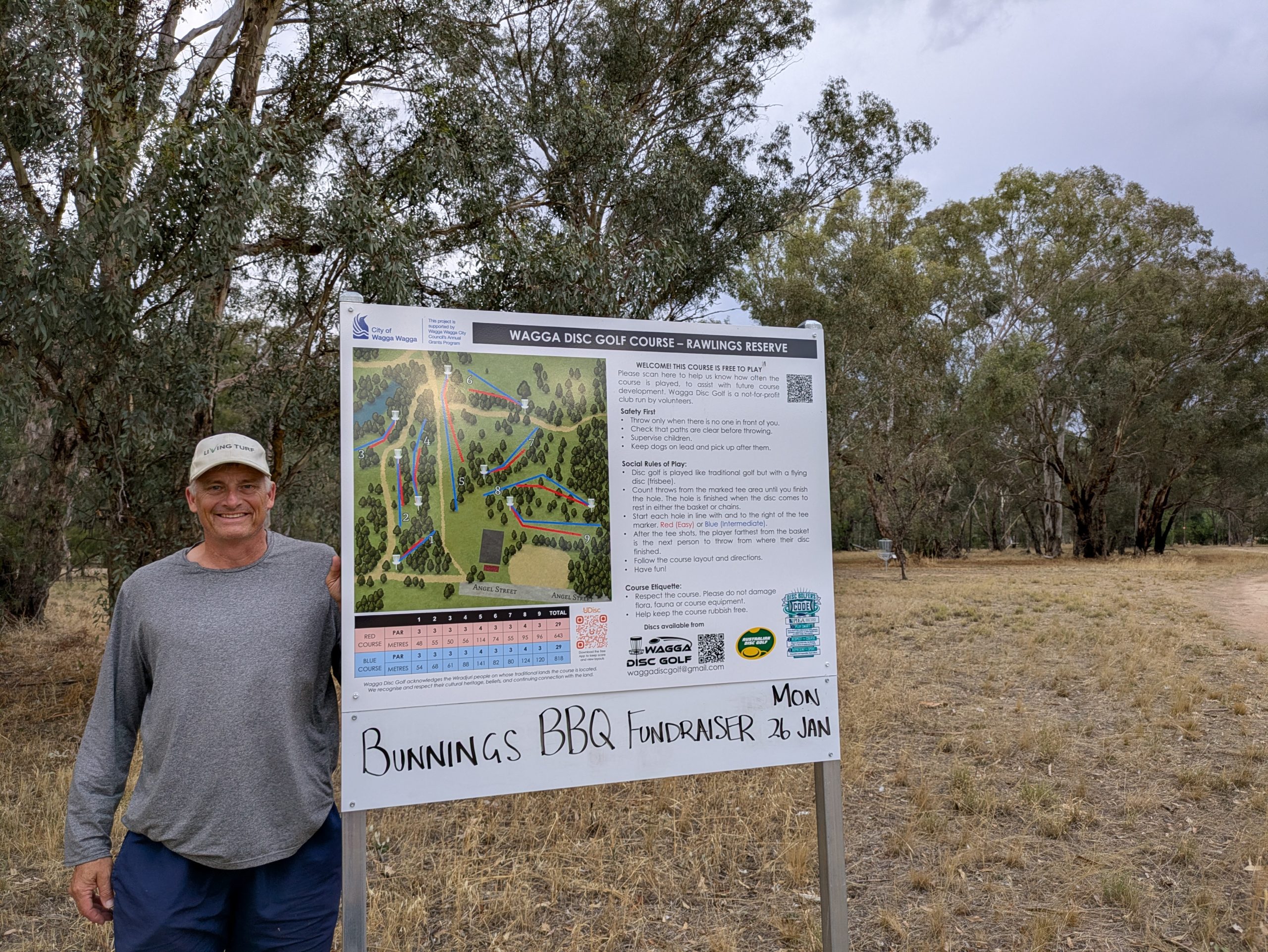 Dean Cartwright proudly shows off the course signage at Rawlings Reserve